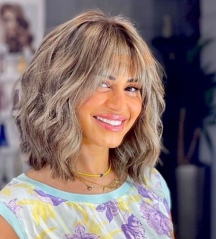 منة فضالي تسحر متابعيها بشعر ابيض جذابة- شاهد