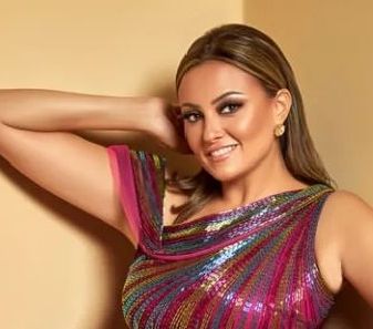 بشري تتألق بالفوشيا في احدث جلسة تصوير لها- شاهد