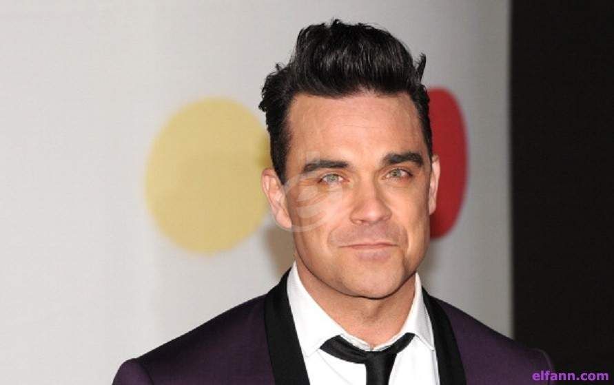 شاهد .. روبي ويليامز يكشف سبب مغادرته فرقة Take That