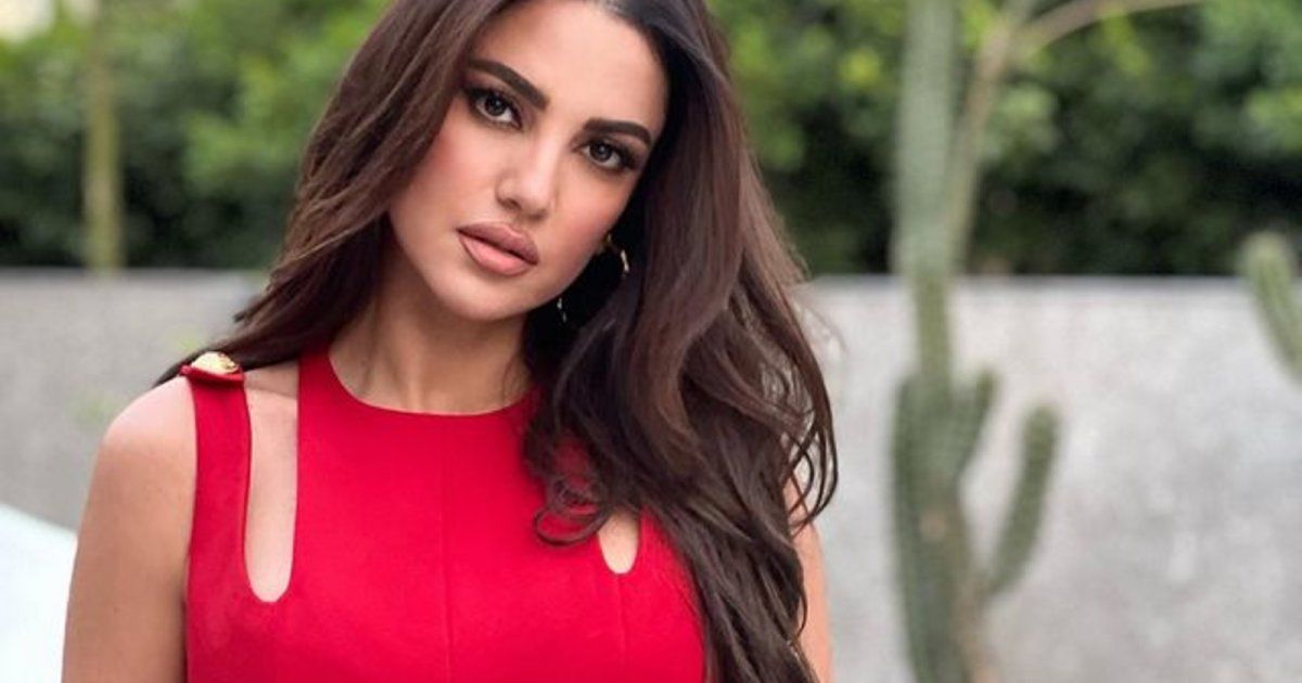 شاهد .. بالصور - درة تتألق في جلسة تصوير على الشاطىء وفستانها من تصميم طوني ورد