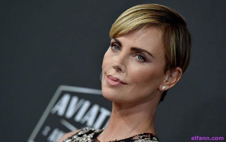 شاهد .. بالصور - تشارليز ثيرون مثال للأناقة في ثيابها المرصعة باللؤلؤ