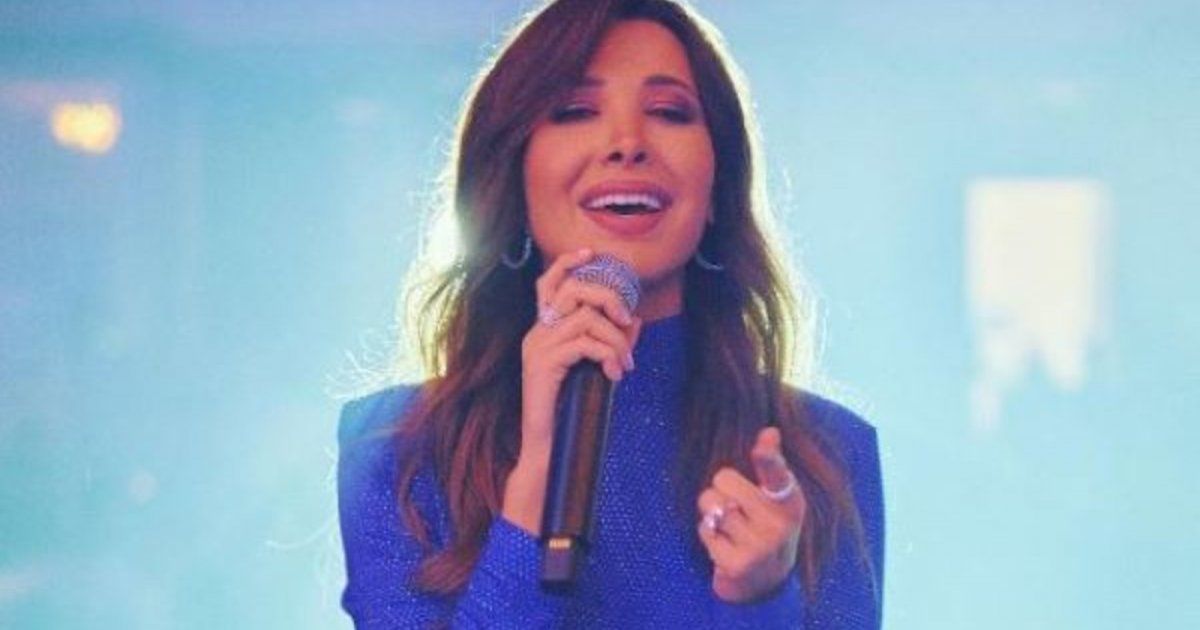 شاهد .. نانسي عجرفي حفل قبرص توقف الغناء لحمل رضيعة وهكذا تعاملت مع معجباتها-بالفيديو