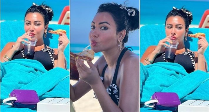 بالبكيني علي البحر : ميرهان حسين بتاكل بيتزا – شاهد