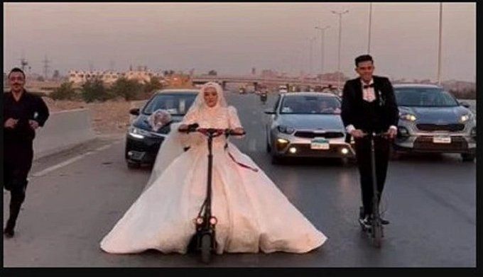 أخبار مصر | أغرب زفة عريس وعروسة في مصر.. سايقين سكوتر كهربائي وتصدروا التريند