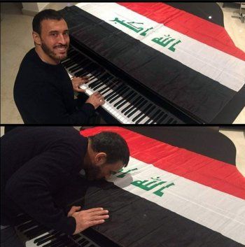 شاهد .. بالصورة - في اليوم الوطني العراقي كاظم الساهر يقبل علم بلاده