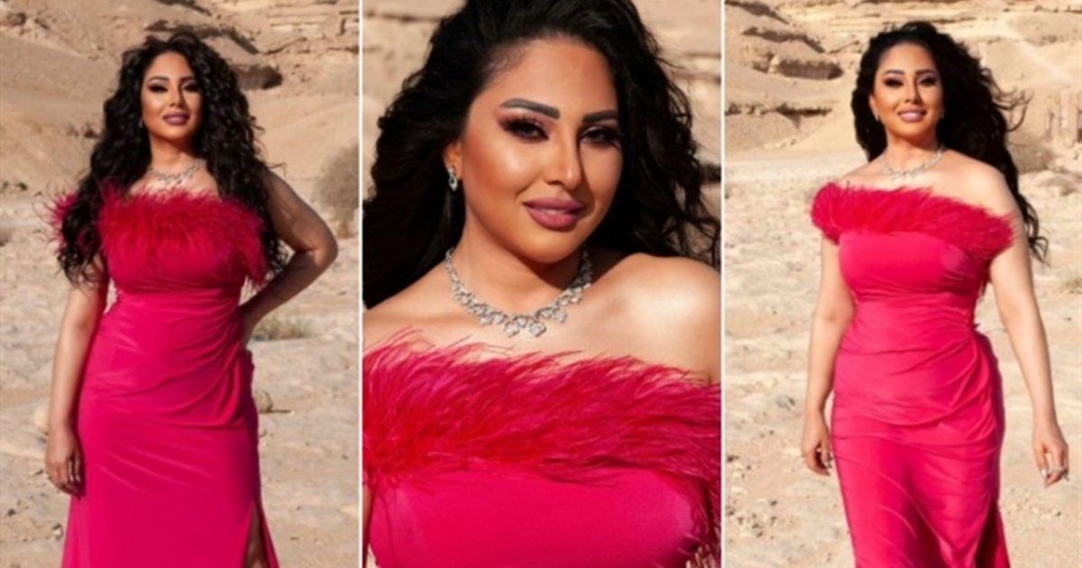 شاهد .. وسط الصحراء.. رحاب الجمل بفستان وردي مزين بالريش - بالصور