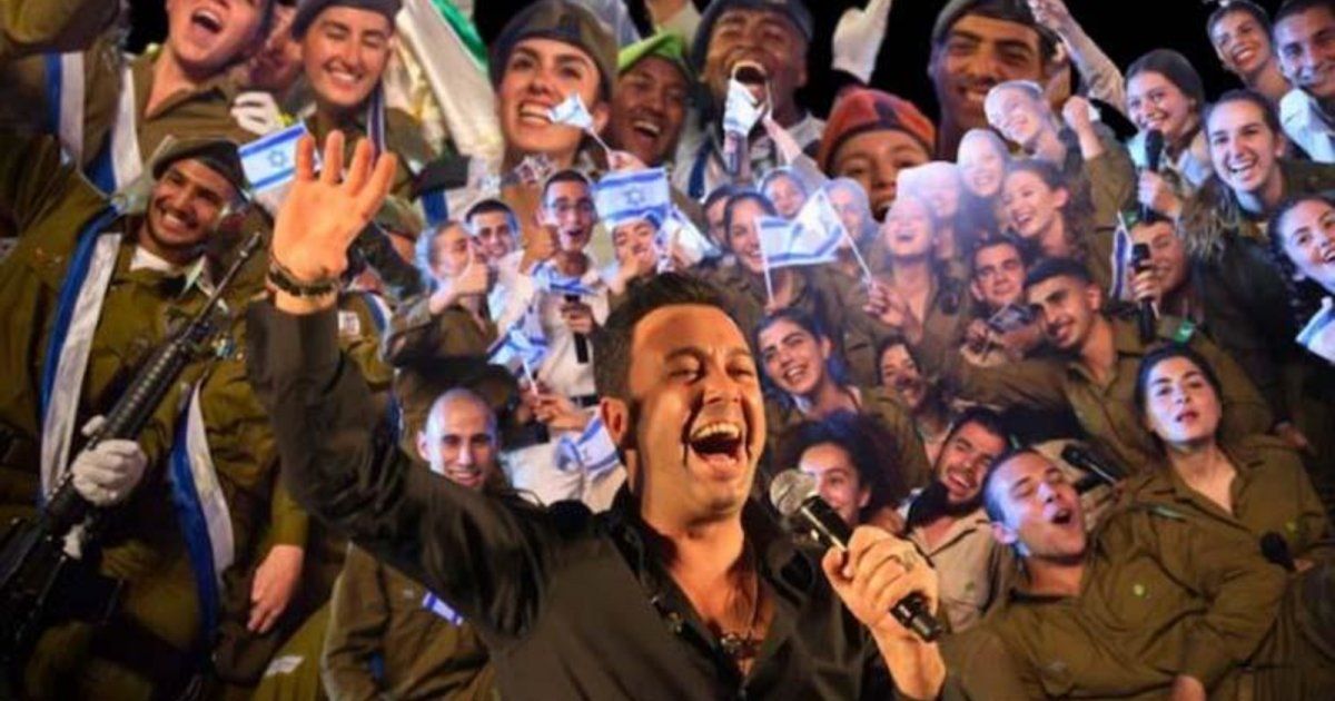 شاهد .. موجة من الغضب .. مغني يصف غ ز ة بالقمامة وبكلمات نابية وسط رقص جنود إسرائيليين