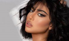 شاهد .. لاميتا فرنجية بإطلالت متعددة بالمايو وروب الحمام وتستجم على البحر مع ولديها-بالصور