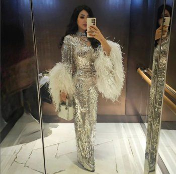 شاهد .. بالصورة- بفستان براق وريش أبيض..لجين عمران تتألق بجمالها