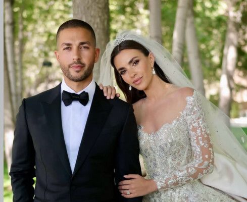 شاهد .. قبلة حميمة تجمع سيليو صعب وزين قطامي في حفل زفافهما - بالفيديو