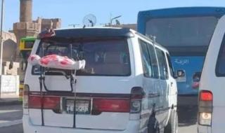 الداخلية تكشف سر الطفل المكفن على سيارة ميكروباص بالقاهرة